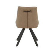 The Pedro Dining Chair features a tan upholstered backrest, black handle, and four black angled metal legs, shown from behind against a white background.