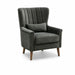 The Charlotte Accent Chair features dark gray velvet and linen upholstery, angled wooden legs, a vertically tufted backrest, and a matching rectangular lumbar pillow—ideal for adding elegance to your home décor.