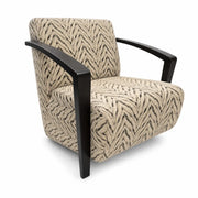 The Falcon Accent Chair features black wooden arms and legs and is upholstered in beige fabric with a black abstract chevron herringbone pattern. Slightly angled to the left, this customizable chair adds a contemporary touch to any stylish living space.