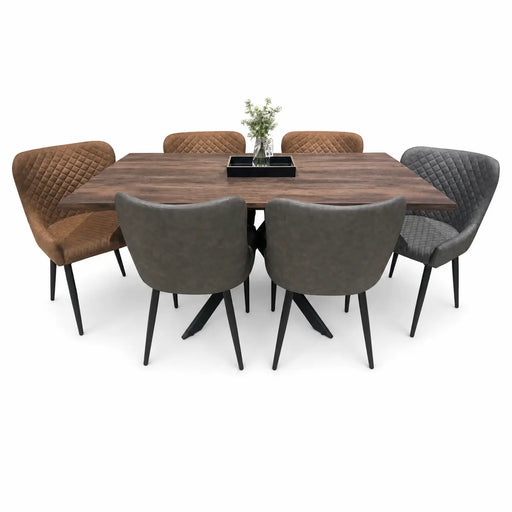 The Elson Table & 6 Diamond Chairs - Special Offer features a wooden dining table surrounded by six cushioned chairs—three brown and three gray. On the table, you'll find a small vase with flowers and a rectangular black tray.