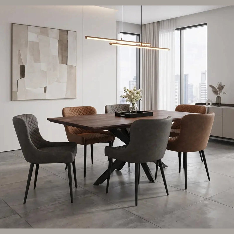 A contemporary dining room featuring the Elson Table & 6 Diamond Chairs - Special Offer, with upholstered seats in brown and gray shades, a sleek pendant light, expansive windows, abstract wall art, and a stylish sideboard with decorative accents.