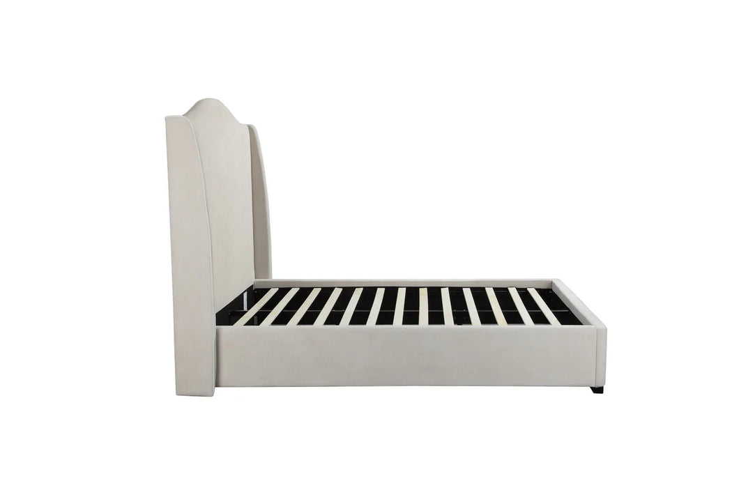 Side view of the Venice Bedframe, featuring a cream upholstered design with a tall, curved headboard and wooden slats for mattress support, exemplifying modern luxury against a plain white background.