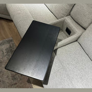 A close-up of the Avery Electric Recliner Corner in light gray, showcasing its modern design with a built-in side table attachment, an open storage compartment, and a convenient electrical outlet.
