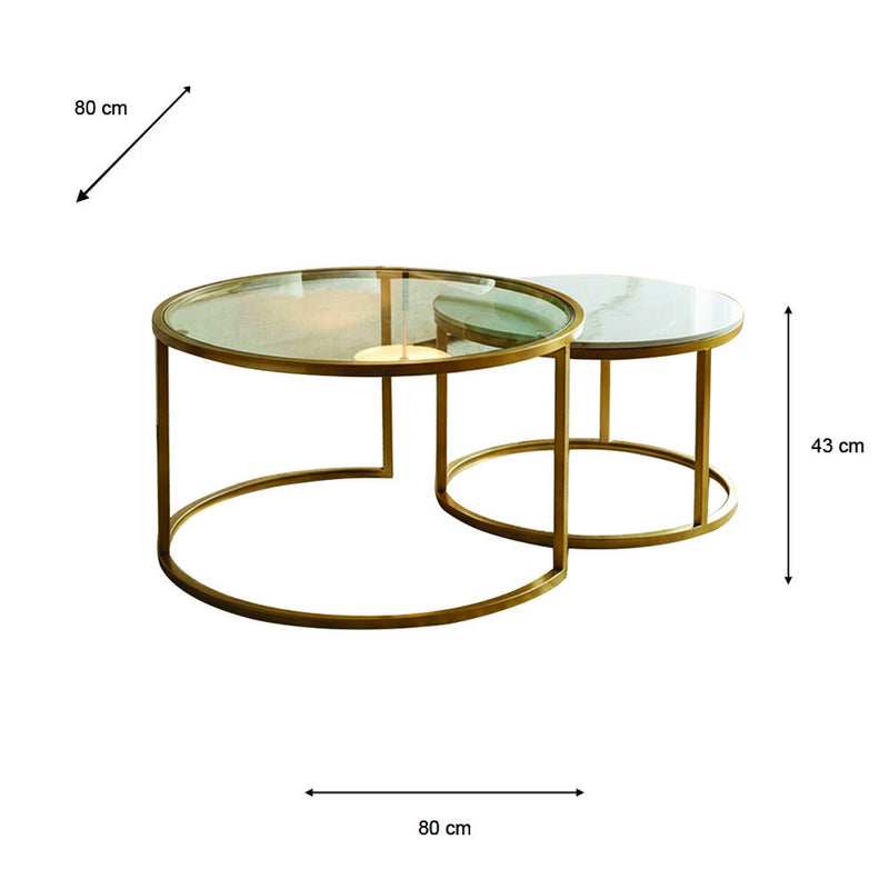 Introducing the Salzburg Nest: a set of two round coffee tables showcasing a refined nesting design with gleaming gold metal frames and sleek glass tops. The larger table measures 80 cm in diameter and 43 cm in height, while the smaller table tucks partially beneath for an elegant, space-saving arrangement. Ideal for modern interiors, Salzburg Nest effortlessly blends practicality with chic style inspired by marble and glass trends.