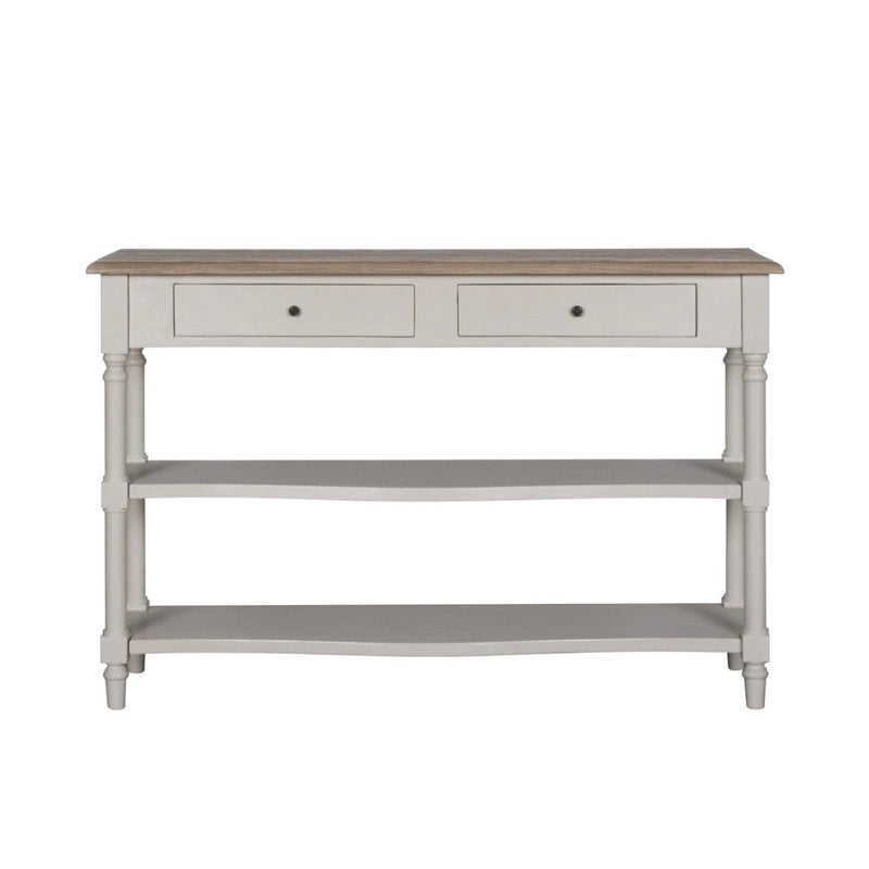 The Lyon Console Table, featuring a white farmhouse design with a natural wood top, two front drawers, and two lower open shelves, is shown against a plain white background.