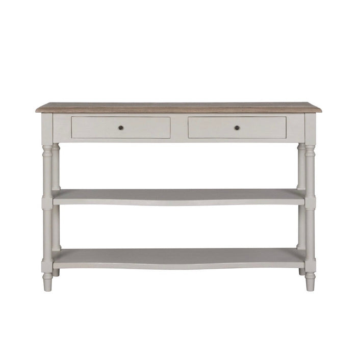 The Lyon Console Table, featuring a white farmhouse design with a natural wood top, two front drawers, and two lower open shelves, is shown against a plain white background.