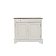 The Lyon 2 Door Sideboard features a simple, classic design in white wood with two doors, a single drawer above, and a brown wood top. Round door knobs complete its farmhouse look, making it an ideal addition to any home.