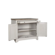 The Lyon 2 Door Sideboard features a white wooden frame with a brown top, one open drawer, and two open doors showcasing an interior shelf—perfect for adding elegant farmhouse charm to any space.