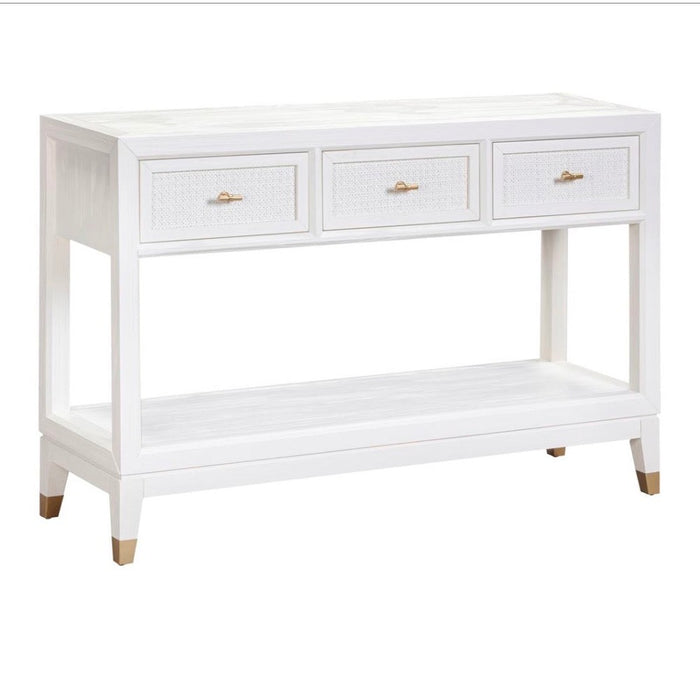 The Bali 3 Drawer Console is a white wooden console table featuring three drawers with gold handles, an open lower shelf, and tapered legs with gold accents—effortlessly bringing coastal-inspired style to your living space.