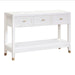 The Bali 3 Drawer Console is a white wooden console table featuring three drawers with gold handles, an open lower shelf, and tapered legs with gold accents—effortlessly bringing coastal-inspired style to your living space.