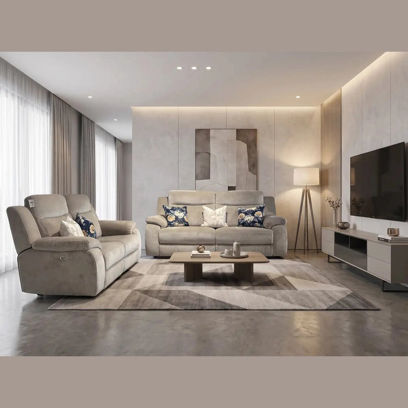 Sure! Here’s the revised sentence incorporating your product: Modern living room featuring two Lorenzo Electric Recliners in taupe washable fabric, complemented by a geometric rug, a coffee table with decorative accents, a floor lamp, striking wall art, and a TV on a sleek console. Large windows with sheer curtains bathe the space in natural light. The neutral and soft color palette completes the inviting atmosphere—perfect for relaxing or entertaining guests.