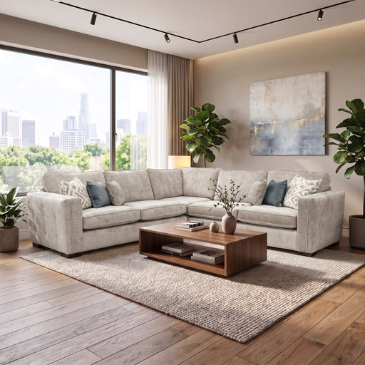 Light gray Ivy Corner sectional sofa in a living room with a low wooden coffee table, area rug, and floor-to-ceiling windows overlooking a city skyline.