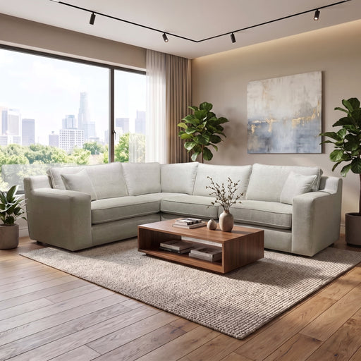 Light gray Alice Corner Group sofa on a textured area rug with a low wooden coffee table in front, upholstered in easy-clean fabric.