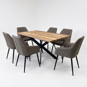 The Elson Light Table + 6 Enzo Chairs features a rectangular wooden top with a black X-shaped base, surrounded by six comfortable chairs with grey upholstery and black metal legs.