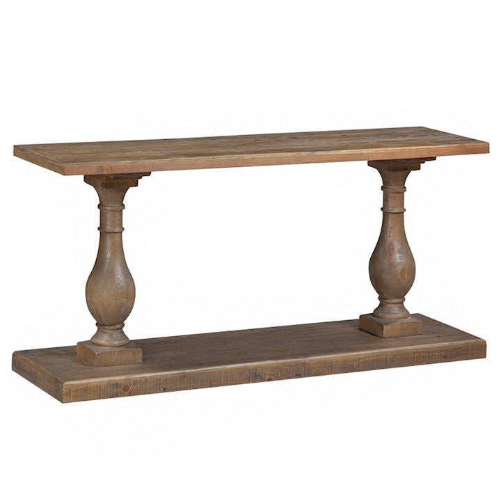 The Donard Console Table features a reclaimed wood rectangular top, two ornate spindle legs, and a thick base in a rustic natural finish—ideal hallway furniture for any home.