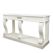 The Large Scroll Console with Drawer is a white sideboard table featuring one center drawer, three curved legs, a lower shelf, and a modern, minimalist design.