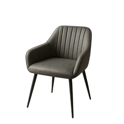 The Enzo Dining Chair features a modern design with dark gray cushioned seats, vertical-stitched backrest, curved armrests, and tapered black metal legs, presented against a white background.
