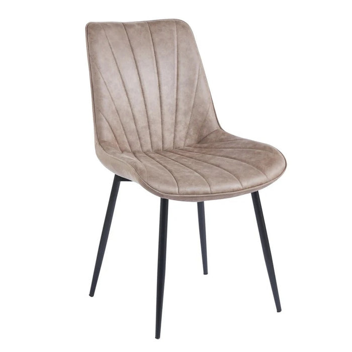 The Lilly Dining Chair features a light brown faux leather seat with vertical stitching and four slim black metal legs, making it an ideal modern accent for your dining space.