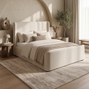 Azure Bedframe with a contemporary upholstered, curved wingback headboard and footboard in a neutral bedroom.