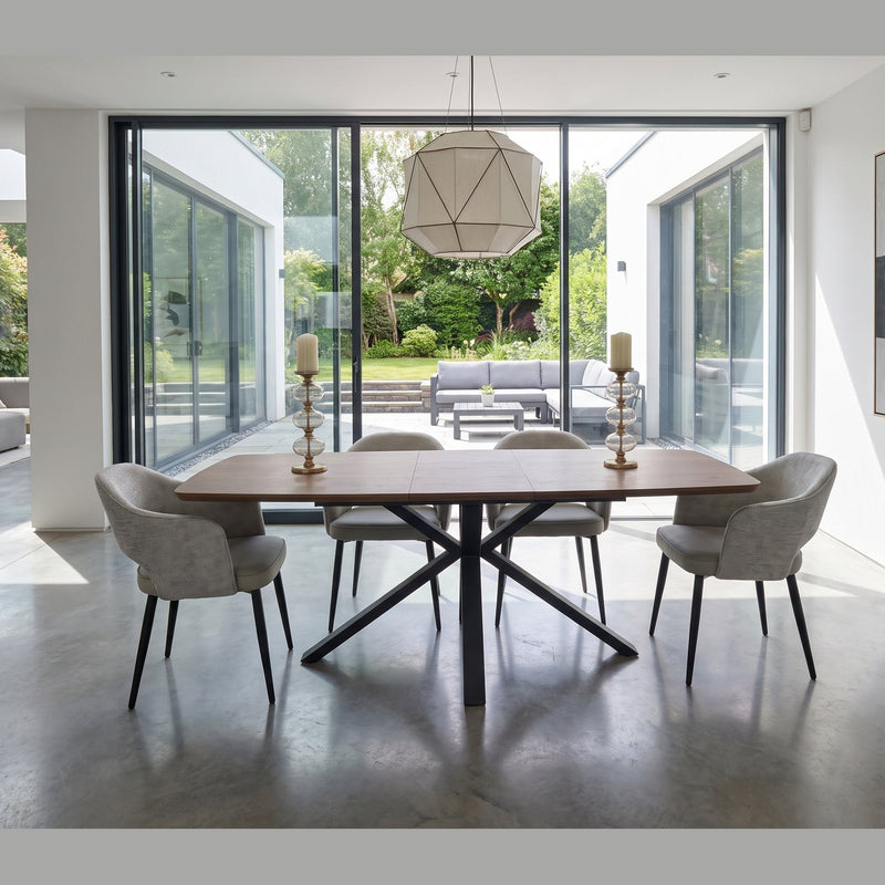 New York Dining table & 6 Macey Chairs with a black metal base, positioned in a room with floor-to-ceiling glass walls overlooking a patio.