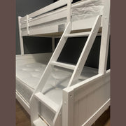 Karol Bunkbeds: White wooden bunk beds with ladder, including mattresses on both bunks. Set against a dark wall and wooden floor, they are an ideal modern solution for children's bedrooms.