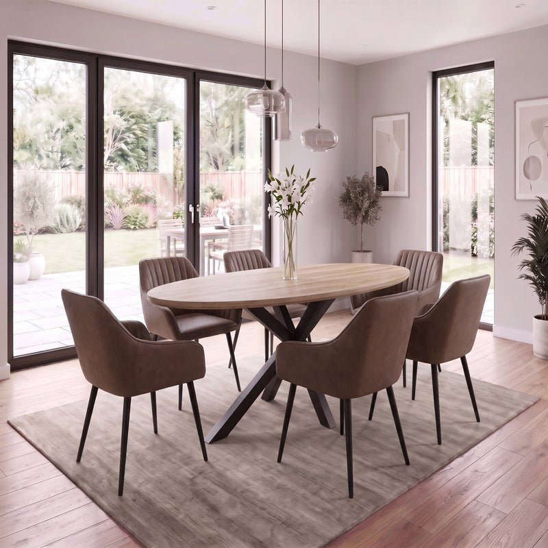 The Elson Oval Table + 6 Enzo Brown Chairs features a modern dining table with an oval wooden top and black x-shaped base, surrounded by six brown upholstered chairs with black legs.