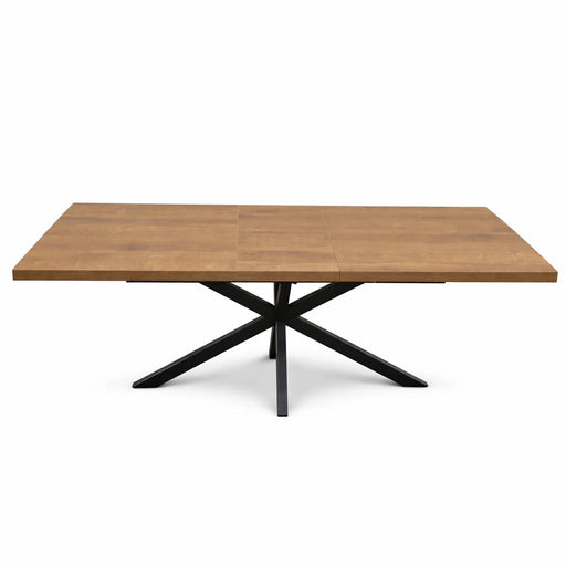 The Panama 1.6 Extending Table features a modern design with a natural wood finish, sleek black metal X-shaped base, and clean straight edges for contemporary appeal.