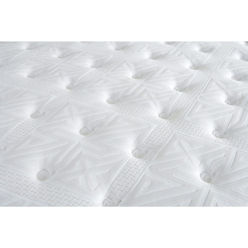 Close-up of the King Koil Boutique Sleep 1500 pocket spring mattress surface, showcasing its white quilted pattern, tufted buttons, geometric designs, and detailed stitching for a soft, cushioned, and plush finish.