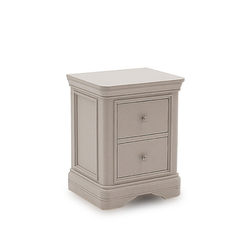 Traditional wooden bedside cabinet with carved plinth and decorative paneling.