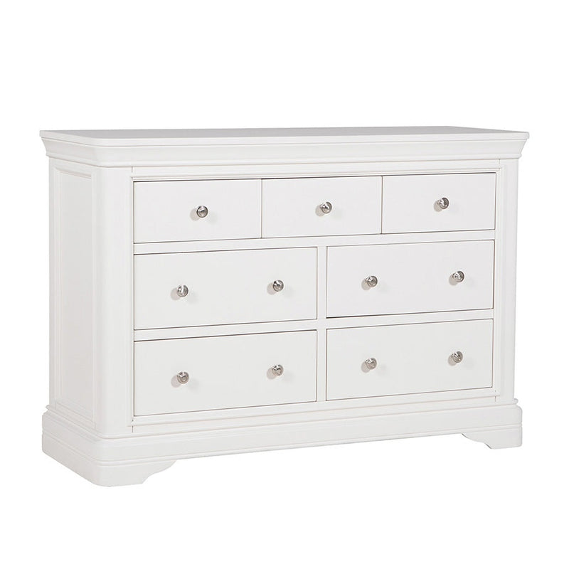 The Mabel Wide Chest by vendor-unknown features seven drawers, silver round knobs, a smooth top, and gently curved base edges—an ideal white wooden dresser to match your contemporary bed frame.