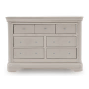 The Mabel Wide Chest by vendor-unknown features a light gray wood finish, three small top drawers, four larger lower drawers, round knobs, and a sturdy classic design that complements contemporary bed frames.