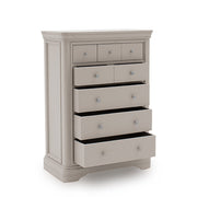 The Mabel Tall Chest by vendor-unknown features six drawers—four partially open—with round silver knobs. Part of the Mabel Bedroom Collection, it brings contemporary style to any bedroom on a plain white background.