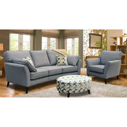 A modern gray fabric Angle seatee with a full range of aquaclean fabrics, featuring a sofa and an armchair set in a living room setting with a patterned ottoman in the foreground.