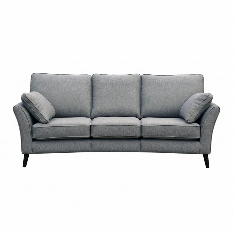 The Retro Angle seatee is a modern light gray, Irish-made three-seater sofa with aquaclean fabric, three seat and back cushions, two matching side pillows, and slim black legs, shown on a white background.