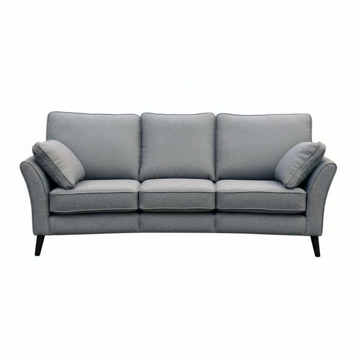 The Retro Angle seatee is a modern light gray, Irish-made three-seater sofa with aquaclean fabric, three seat and back cushions, two matching side pillows, and slim black legs, shown on a white background.