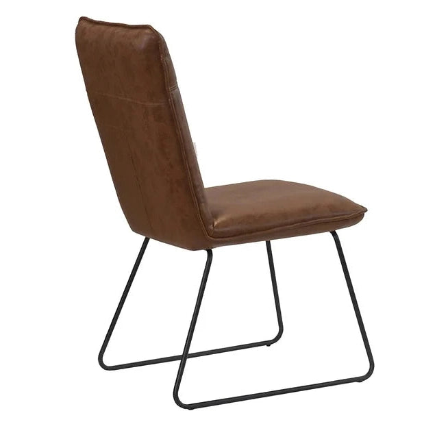 The Richmond Dining Chair features a modern industrial design with brown cushioned PU leather seat and backrest, supported by a black metal sled-style base, shown from a rear side angle.