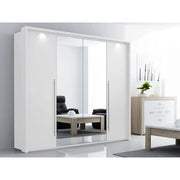 The Brema Sliderobe by vendor-unknown, a modern mirrored sliding door wardrobe with LED lighting, stands in a bright room reflecting a black chair, wooden coffee table, and a white chest of drawers with a plant and artwork above.