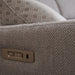 Close-up of an Otis Range light gray upholstered recliner arm with a geometric cushion and an embedded electronic control panel featuring two buttons to adjust the electric headrest.