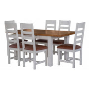The Skellig Dining Table extending 1.4 by vendor-unknown features a brown oak top with white legs and comes with six matching white chairs, each with a brown cushioned seat.