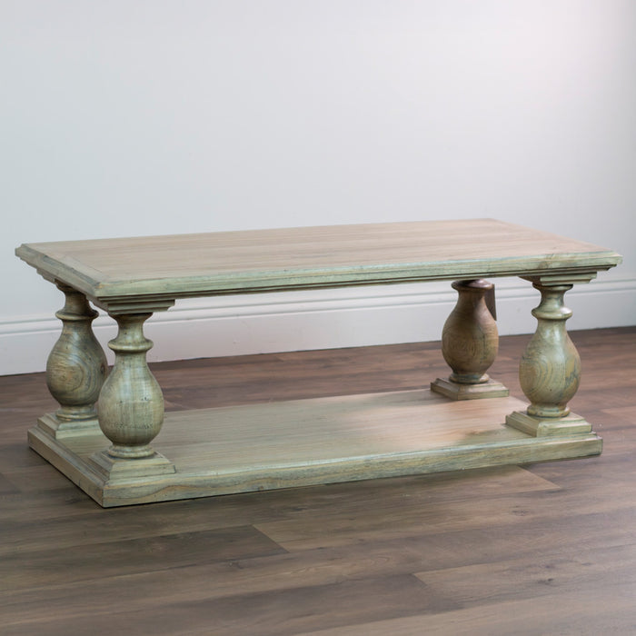 The Marwood Coffee Table is a rectangular wooden piece with a light finish, four thick baluster-style legs, and a lower shelf. Dimensions: 120 cm wide, 45 cm high. It sits on a hardwood floor against a plain white wall.