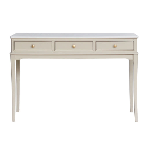 The Monroe Large Console - Stone features a light beige finish, three drawers with round knobs, a marble top, and four tapered legs—an elegant storage piece for your living space.