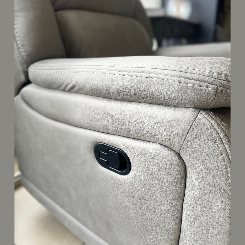 Close-up of the light gray Reno Recliner Sofa, highlighting the side panel with a black reclining lever. The detailed stitching and texture of the washable fabric are clearly visible.