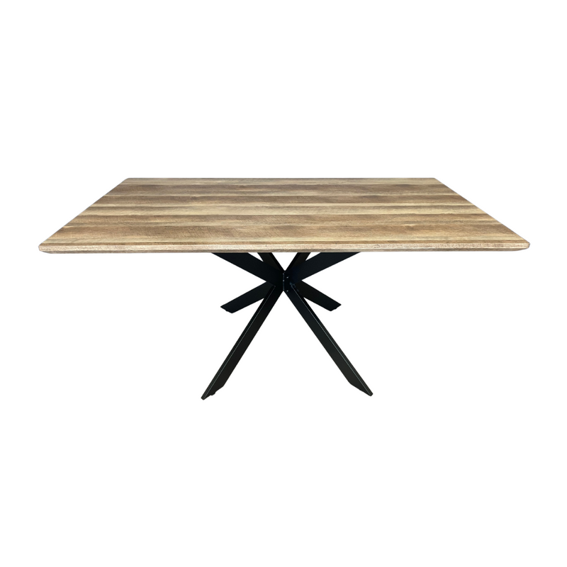 The Elson 1.6 Dining Table is a square wooden table with a light brown natural finish and a modern black metal pedestal base featuring bold X-shaped legs.