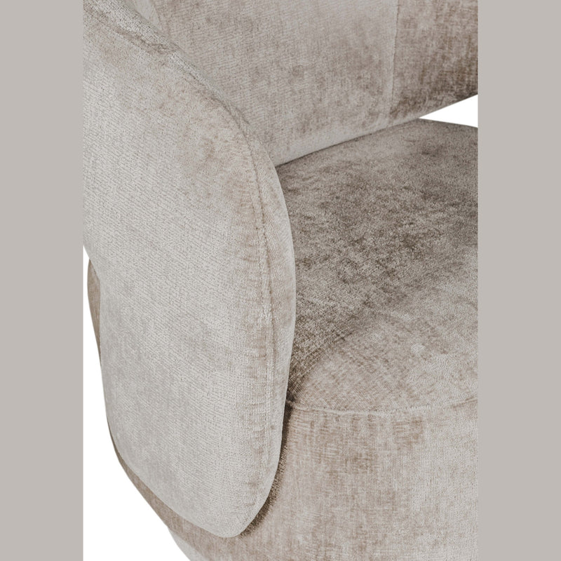 Close-up of the Koa Accent Chair showcases its contemporary style and plush, light beige mink upholstery, focusing on the seat, armrest, and part of the backrest with a soft, textured finish.
