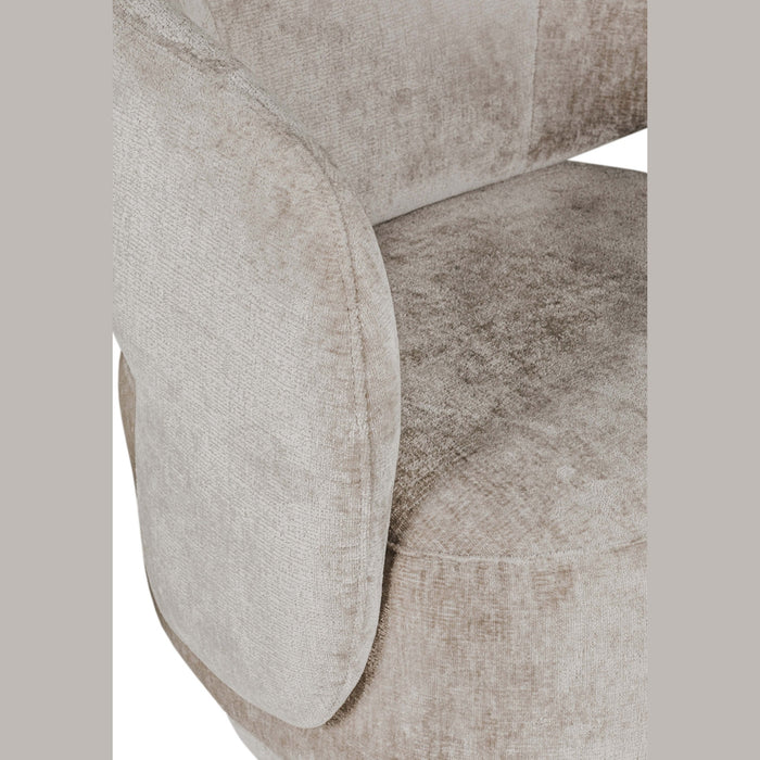 Close-up of the Koa Accent Chair showcases its contemporary style and plush, light beige mink upholstery, focusing on the seat, armrest, and part of the backrest with a soft, textured finish.