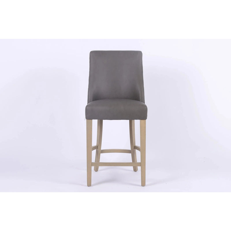 The Millie Counter Stool features a gray upholstered seat, high backrest, and light wood legs in easy-clean leatherette—an ideal blend of style and comfort for dining spaces. Displayed on a plain white background.