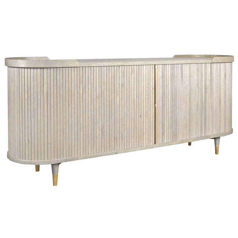 The Preston Large Sideboard features light wood, vertical grooves, rounded corners, four short legs, and two central doors in a modern, minimalistic design.