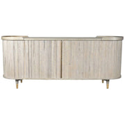 The Preston Large Sideboard features a light wood finish, curved edges, vertical slatted front detailing, and short tapered legs.