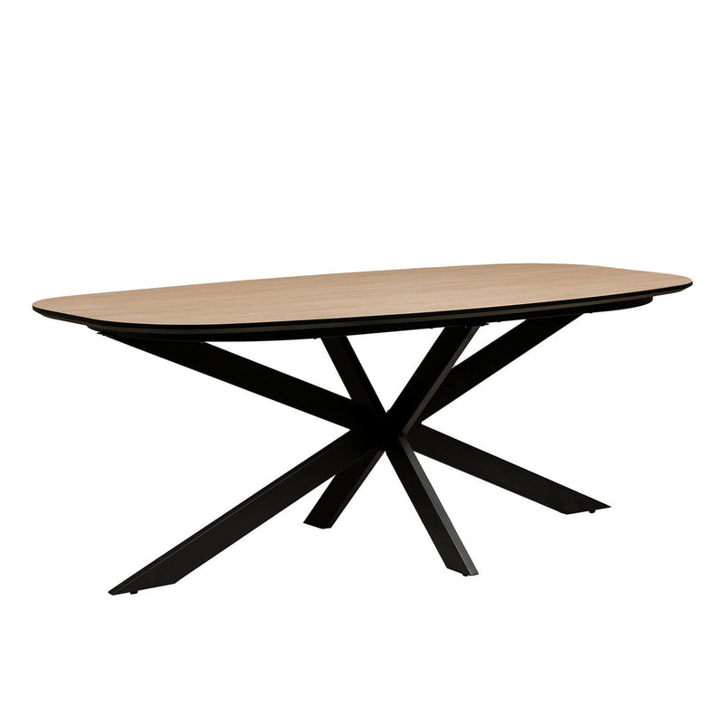 The Sadie Oval Dining Table features a light wood top and black metal legs crossed in an X-shape, shown on a plain white background.