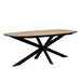 The Sadie Oval Dining Table features a modern design with a light wood top, rounded corners, and four black angled metal legs that intersect at the center.